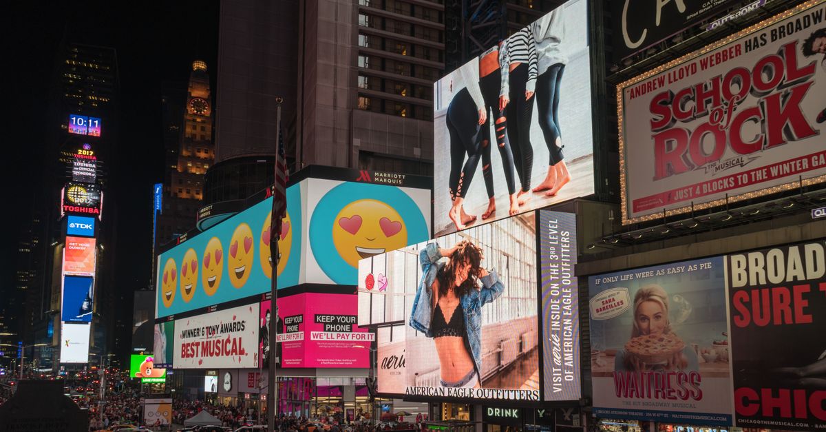 Content That Converts: Proven Strategies for Social Media Success in New York Colorful billboards light up New York City's iconic Times Square at night, with vibrant ads and bustling crowds.
