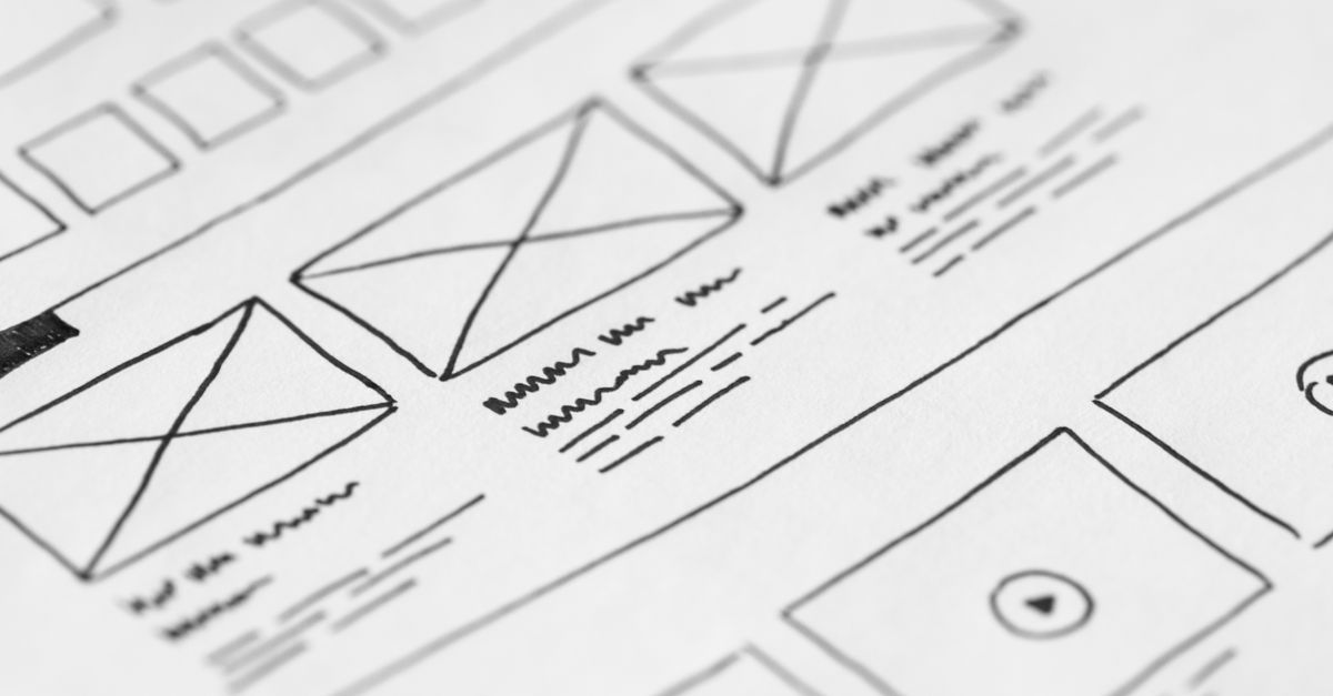 E-Commerce Website Development in Kuala Lumpur: Complete 2026 Guide Detailed close-up of a hand-drawn wireframe design on paper for a UX project.