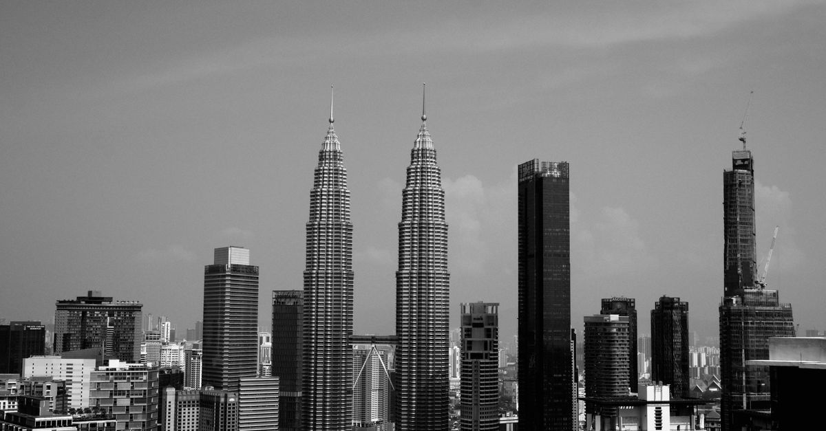 GEO Generative Engine Optimization: Boost AI Search Rankings in Kuala Lumpur, Malaysia Stunning black and white view of Kuala Lumpur's skyline featuring the iconic Petronas Towers.