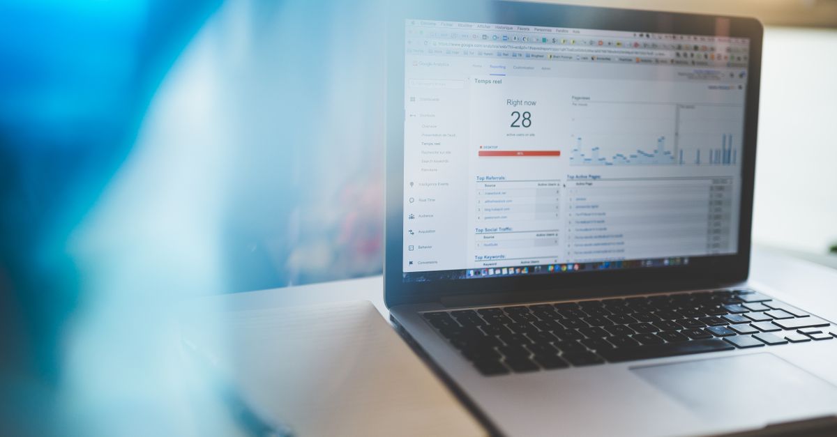 How to Choose an SEO Consultant for Small Business in Kuala Lumpur – 2026 Guide Laptop displaying Google Analytics in a modern workspace, highlighting digital analytics and technology.