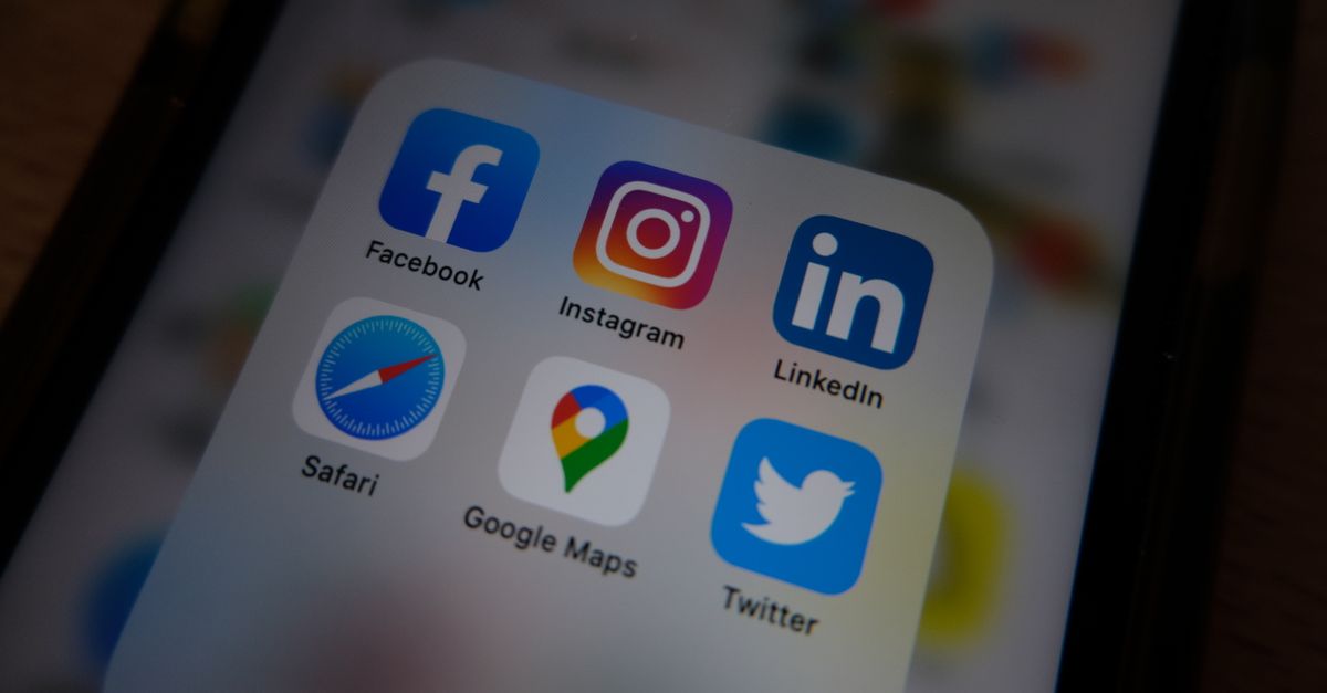 Close-up view of popular social media app icons on a smartphone screen.
