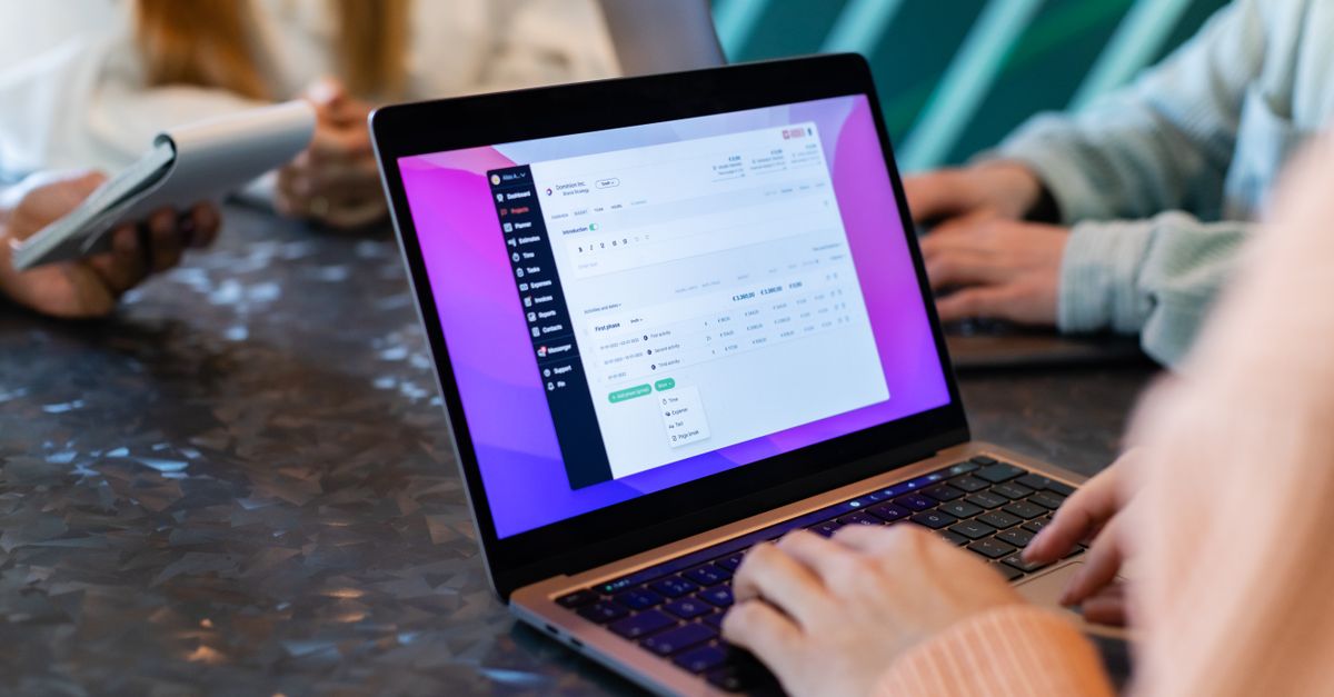 Close-up of a laptop during a team meeting in New York, showcasing collaboration and technology.